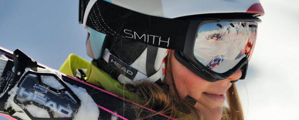 Woman wearing Hoys rental ski equipment and outer wear